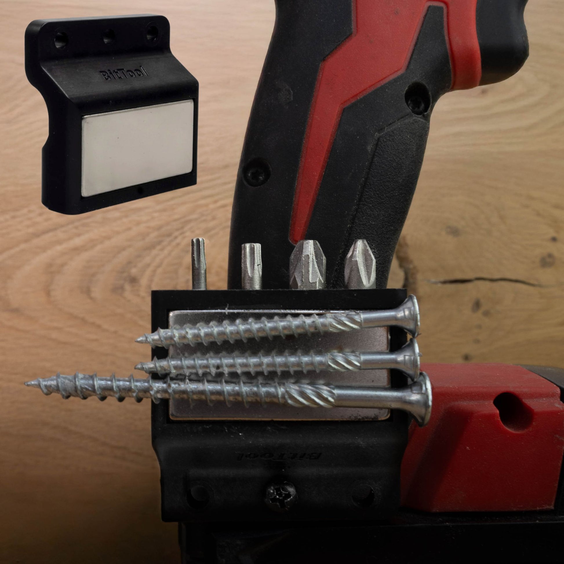 Magnetic bit and screw holder attached to a cordless drill – SharpTools BitTool holding multiple screws and bits on drill housing
